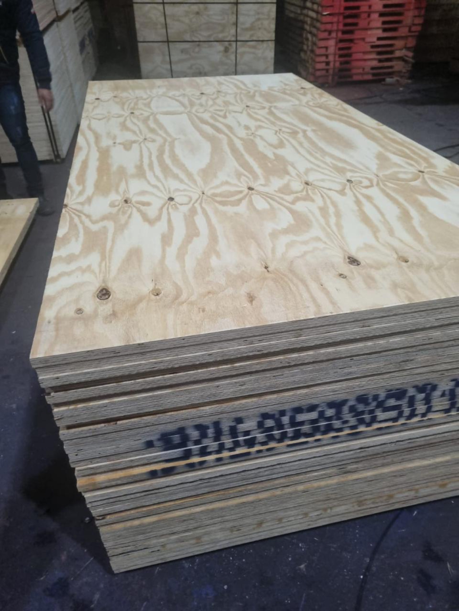CDX structural plywood sheets stacked in warehouse